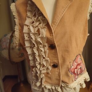 Light pink upcycled vest.